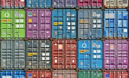 Stacked containers illustrating SaniChem SA's expertise in transport trucks and container sanitisation.